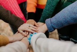 Hands meeting in a circle