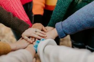 Hand meeting in a circle